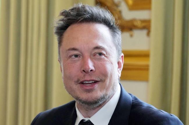 FILE - Twitter, now X. Corp, and Tesla CEO Elon Musk poses prior to his talks with French President Emmanuel Macron, May 15, 2023, at the Elysee Palace in Paris.  (AP Photo/Michel Euler, Pool, File)