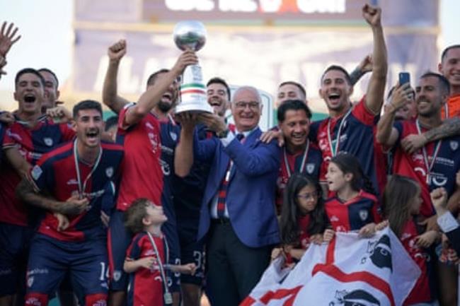 Cagliari coach Claudio Ranieri and his players celebrate being promoted to Serie A