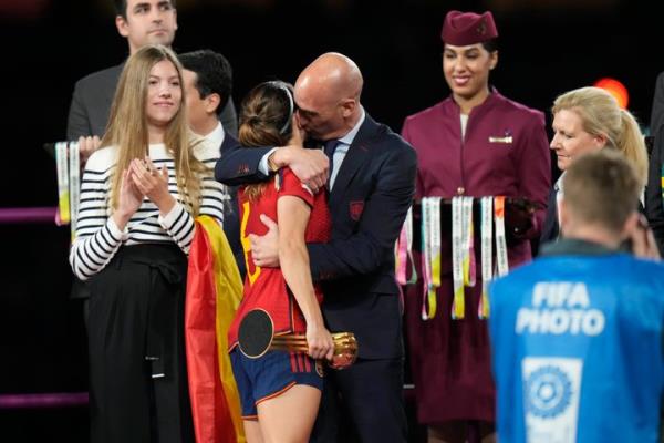 Luis Rubiales, right, hugs Spain's Aitana Bo<em></em>nmati on the podium following Spain's win in the final of Women's World Cup soccer against England.